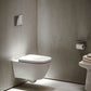 Billede af badeværelse med væghængt toilet